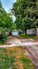 View of yard with a garage