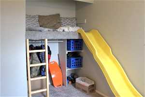 1st bedroom also features a slide and reading nook.