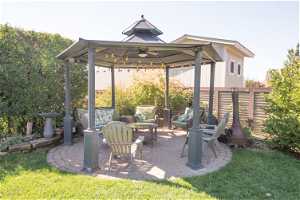 View of patio with a pergola and ceiling fan