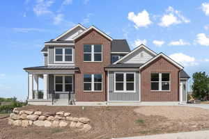 View of front of house featuring covered porch