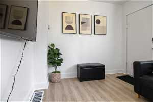 Sitting room featuring light hardwood / wood-style flooring