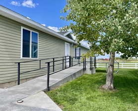 View of home's exterior featuring a lawn