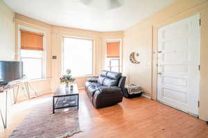 Living room with light wood-type flooring