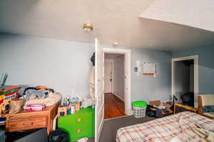 Bedroom featuring dark carpet