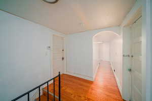 Corridor with lightwood-style floors