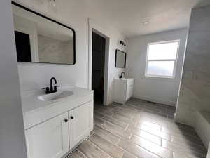 Bathroom featuring double sink vanity