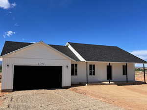 View of front of property with a garage