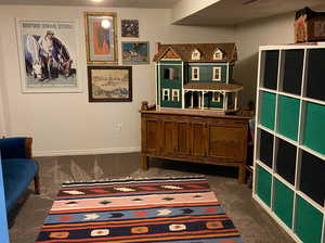 Playroom/ Bedroom connected to the first basement bedroom.