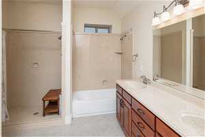 Bathroom featuring double sink, tile floors, and oversized vanity