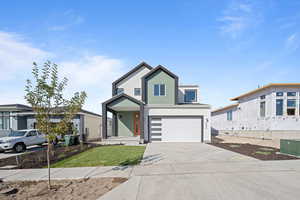 View of front of home featuring a garage