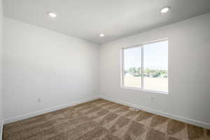 View of carpeted spare room