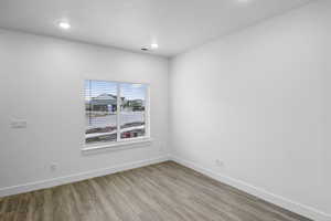 Empty room featuring light wood-type flooring