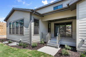 Entrance to property featuring covered porch