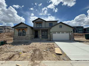 View of front of property with a garage