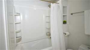 Jetted tub/shower combination and toilet