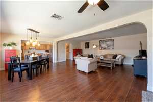 Living  & Dining room featuring dark hardwood / wood-style floors with beautiful chandelier