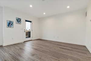 Spare room featuring dark hardwood / wood-style flooring