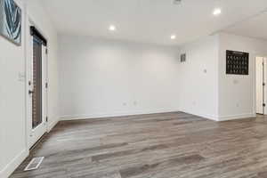 Spare room with hardwood / wood-style floors