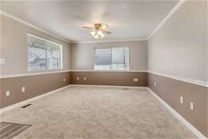 Living room with crown molding.
