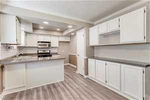 Kitchen with ample cabinet storage.