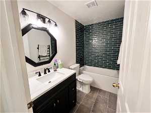 Full bathroom with modern shower / bathtub combination, vanity, and tile flooring, and heated towel warmer