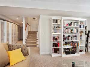 Living area featuring light colored carpet