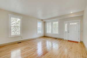 Entrance foyer featuring light hardwood / wood-style flooring