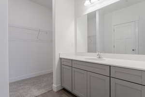 Bathroom featuring vanity and hardwood / wood-style flooring