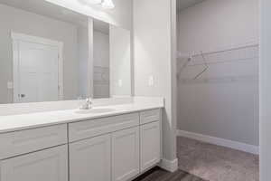 Bathroom with vanity and hardwood / wood-style floors