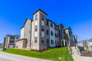 View of building exterior with a garage