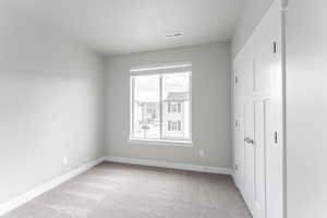 Unfurnished bedroom featuring carpet