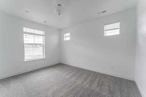 Empty room featuring carpet floors