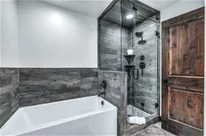 Bathroom with shower with separate bathtub