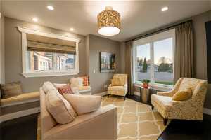 Living room with plenty of natural light and dark hardwood / wood-style floors