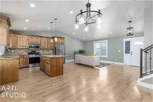 Kitchen featuring an inviting chandelier, decorative light fixtures, light wood-type flooring, and stainless steel appliances