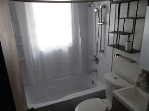 Full bathroom with vanity, toilet, and shower / bathing tub combination