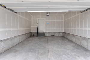 Garage featuring a garage door opener