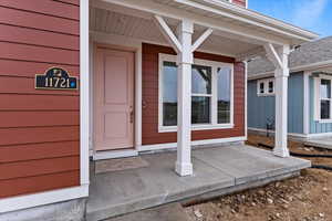 Entrance to property featuring a porch