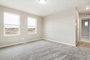 Unfurnished room with carpet floors