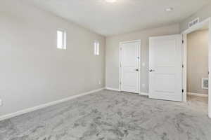 Empty room featuring carpet flooring