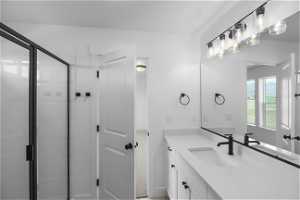 Primary Bathroom with Dual Sink vanity with extensive cabinet space and a shower with shower door