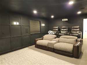 View of carpeted cinema roomwith dimmable lighting