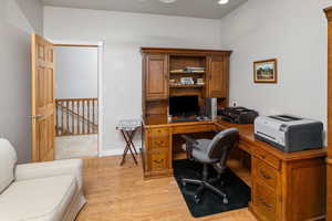 Office area featuring light hardwood / wood-style floors