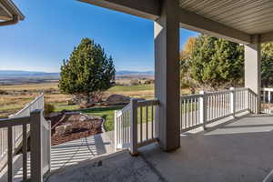 Balcony featuring a mountain view and a rural view