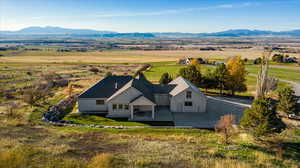 Birds eye view of property featuring a mountain view and a rural view