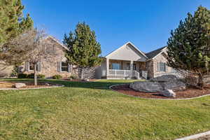 View of front of property with a front lawn