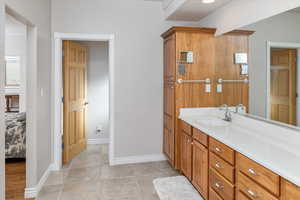 Bathroom with oversized vanity and tile floors