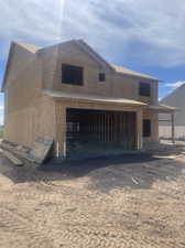 View of front of home with a garage from northeast corner