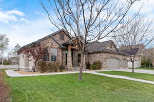 View of front of property with a front lawn