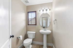 Bathroom with toilet and tile floors